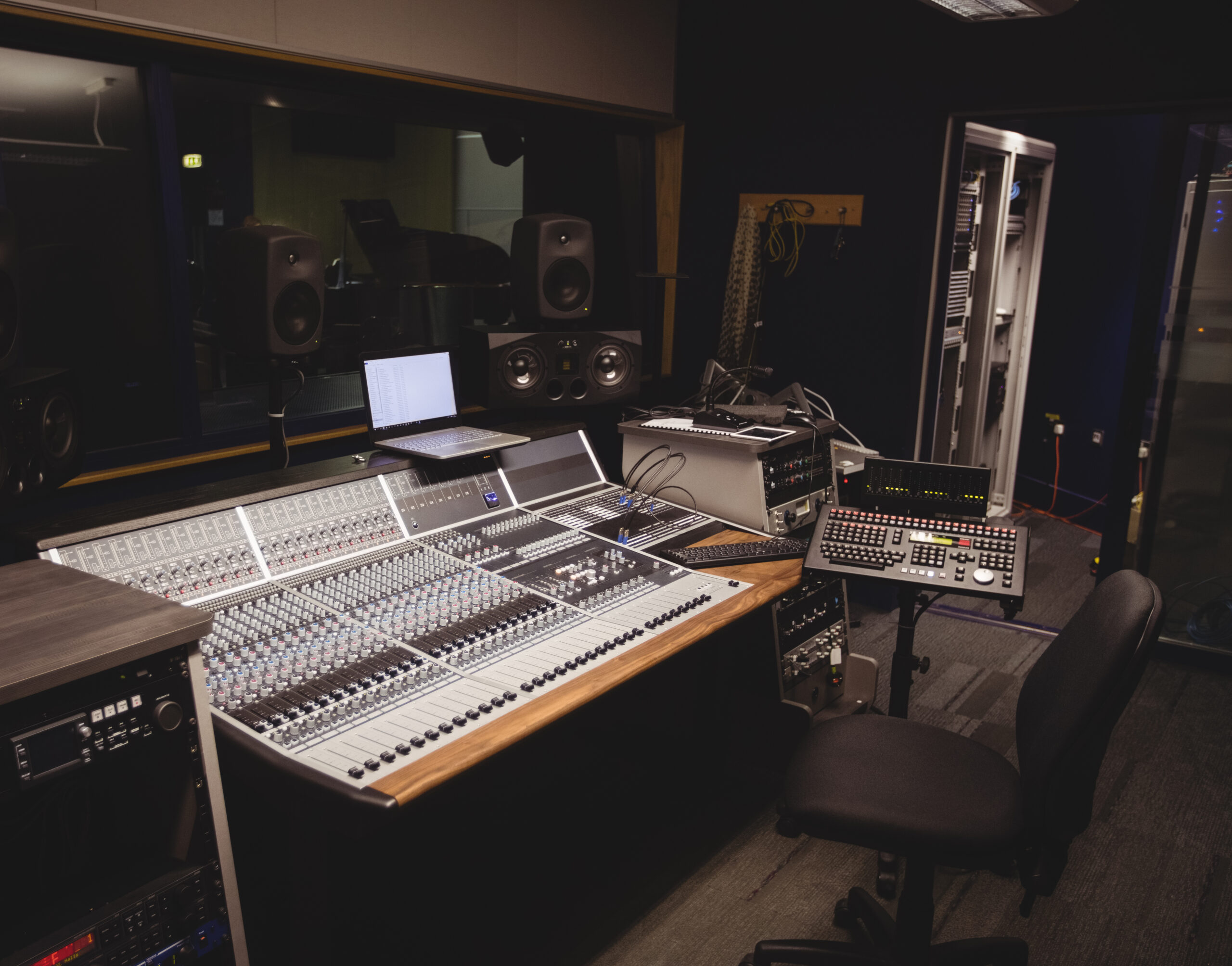 Sound mixer in a studio with laptop